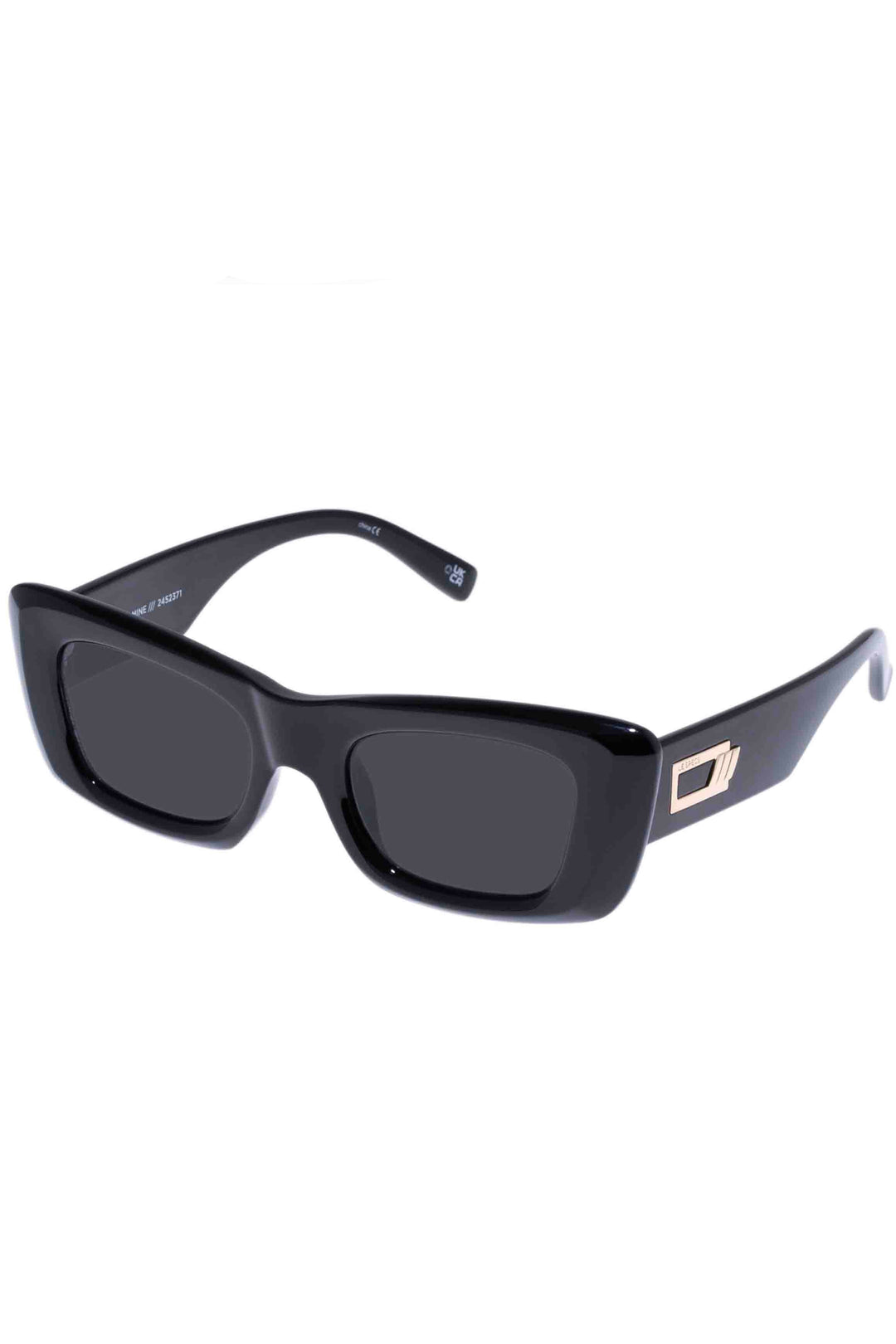 side view of Shiny Black Dopamine Sunglasses by Le Specs with gold hardware and dark tonal lenses.