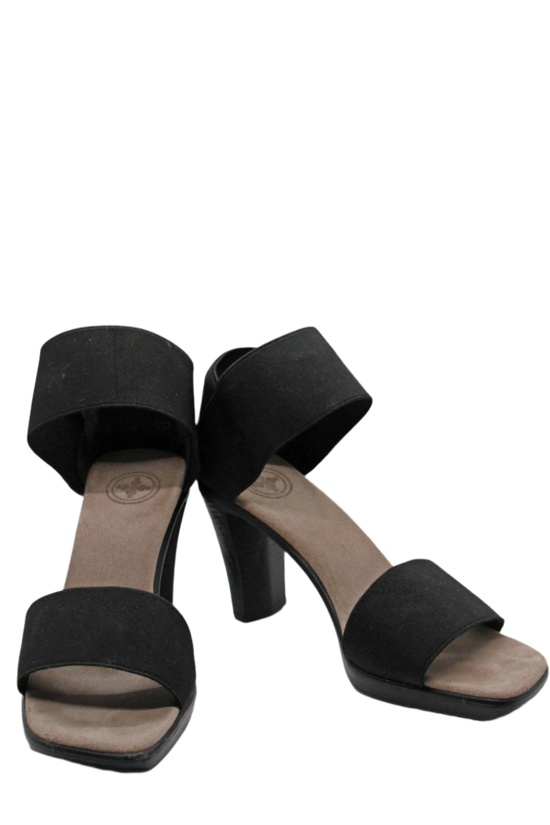 angled view of black cocktail sandal by Charleston Shoes with a 3 1/2" heel and a wide stretch upper toe band and ankle straps with a closed back