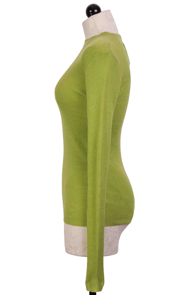 side view of Green Ribbed Mock Neck Top by Compania Fantastica