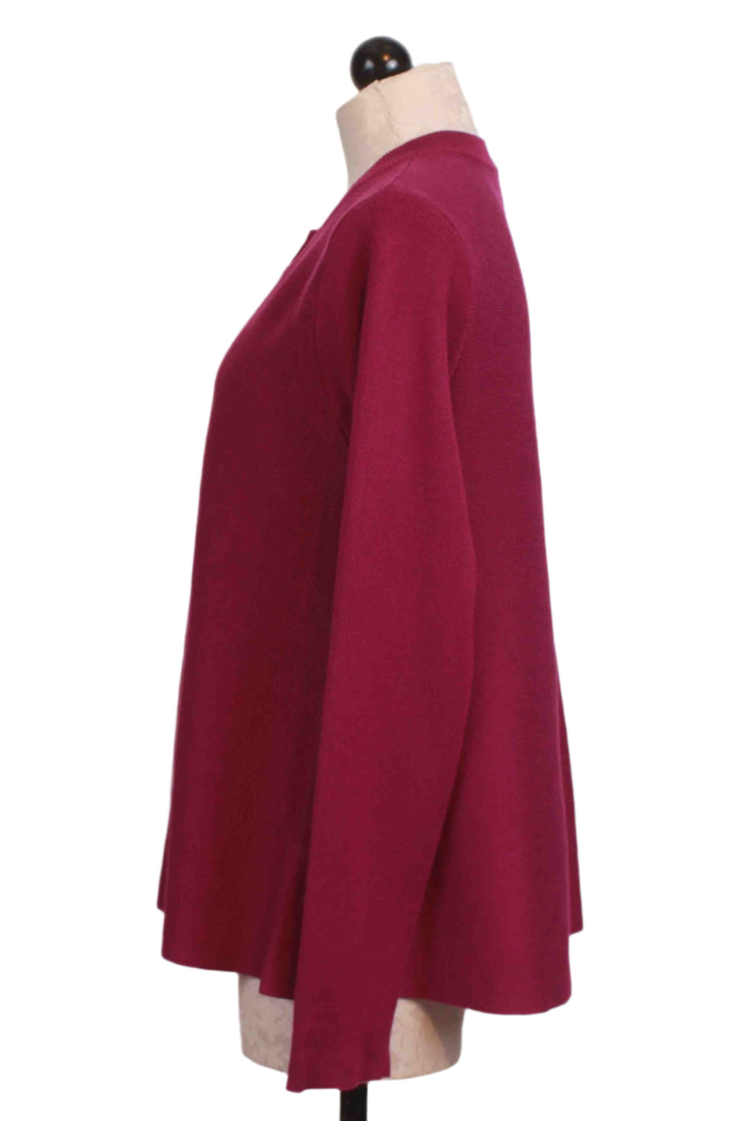 side view of Magenta Cropped Flared Cardigan by Compania Fantastica