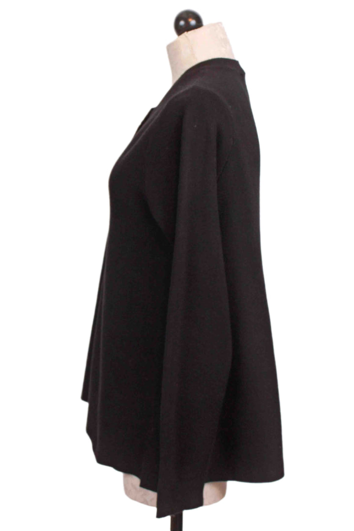 side view of Black Cropped Flared Cardigan by Compania Fantastica