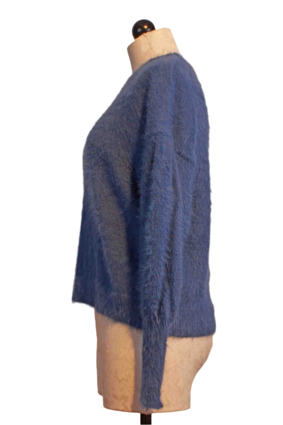 side view of blue Fuzzy Blouson Sleeve Sweater by Compania Fantastica