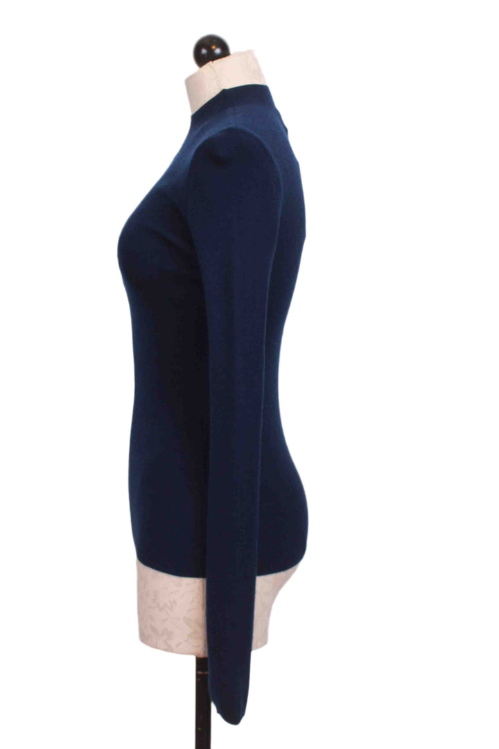 side view of Navy Blue Ribbed Mock Neck Top by Compania Fantastica