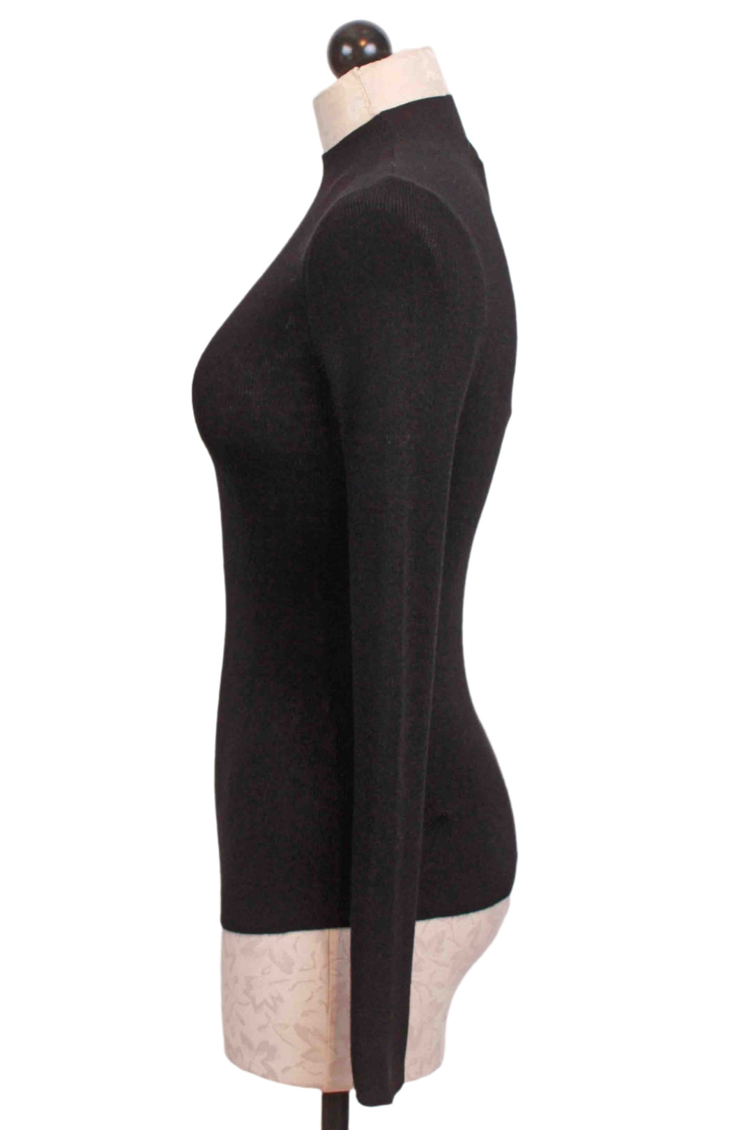 side view of Black Ribbed Mock Neck Top by Compania Fantastica