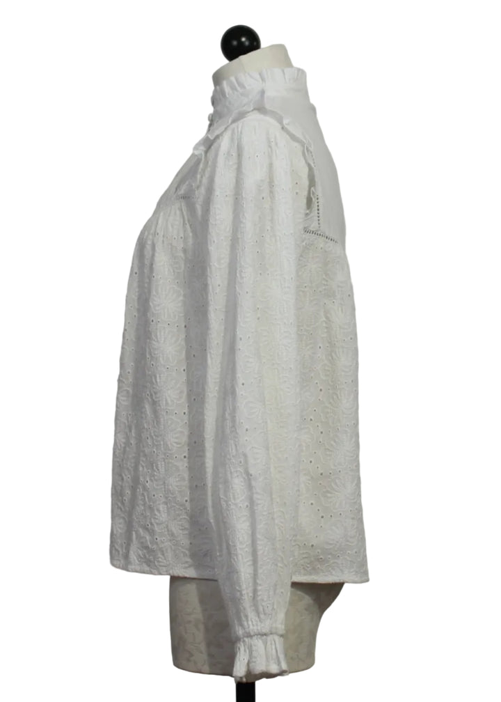 side view of White Embroidered Ruffle Neck and Sleeve Carola Blouse by MKT Studio