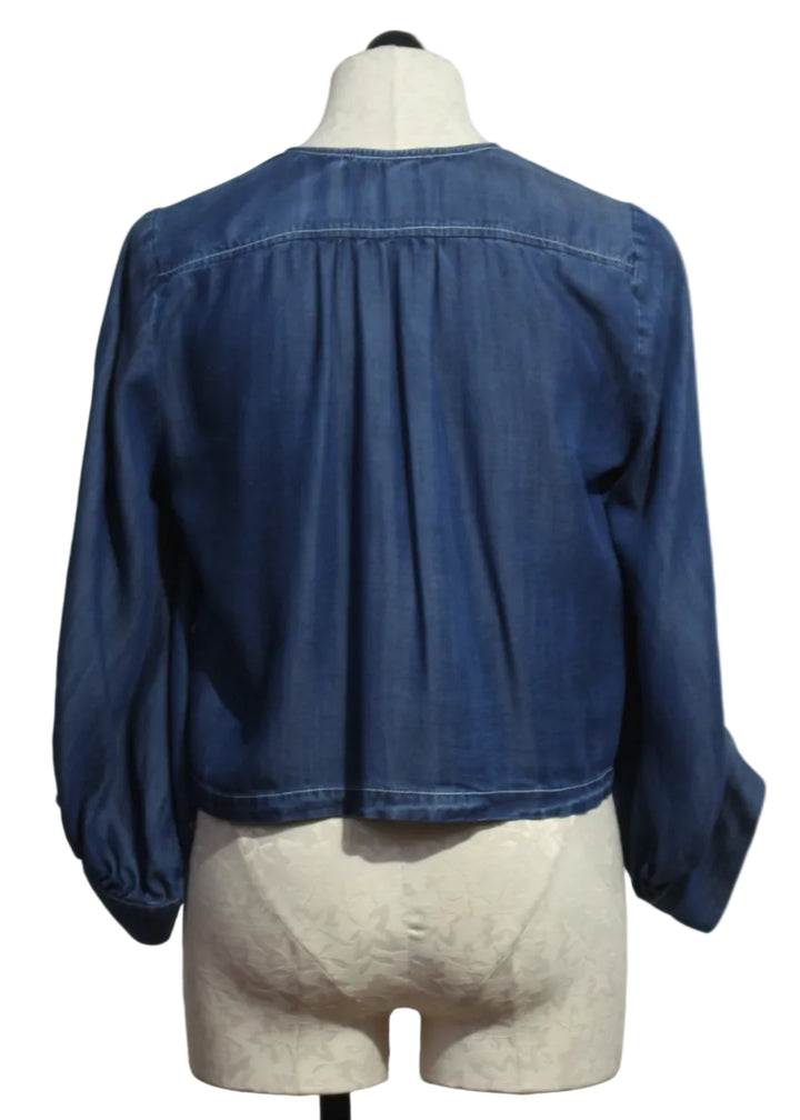 back view of Chambray Cassie Lantern Sleeve Top by Fifteen Twenty