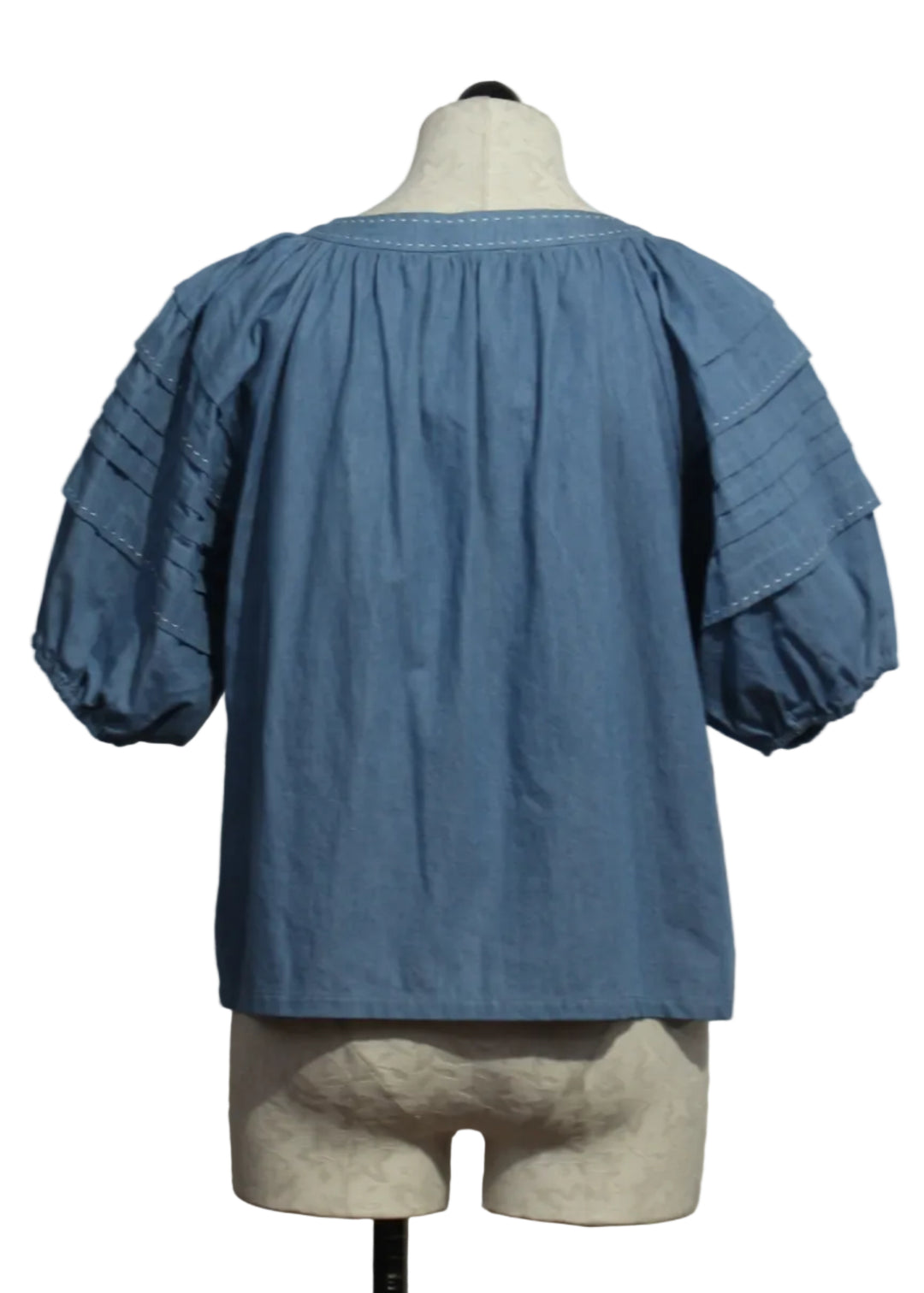 back view of Chambray Shay Contrast Stitch Peasant Top by Fifteen Twenty