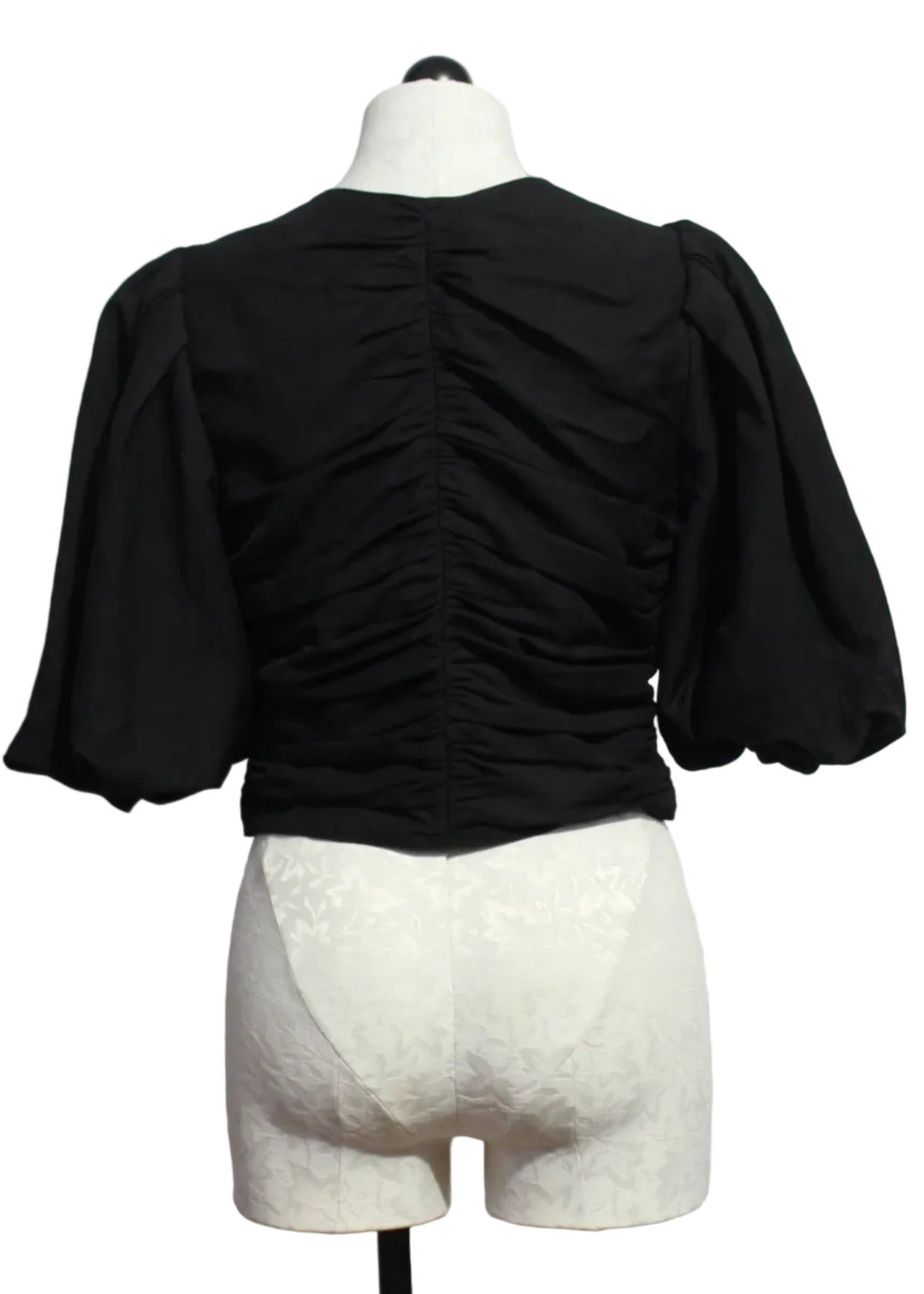 back view of The black cropped Rowan Top by Marie Oliver with short blouson sleeves and ruched detailing on the front and back.Rowan Top by Marie Oliver 