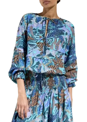 Model wearing the Umi Blouse by Marie Oliver in the Medusa Print paired with the matching Stacie Skirt