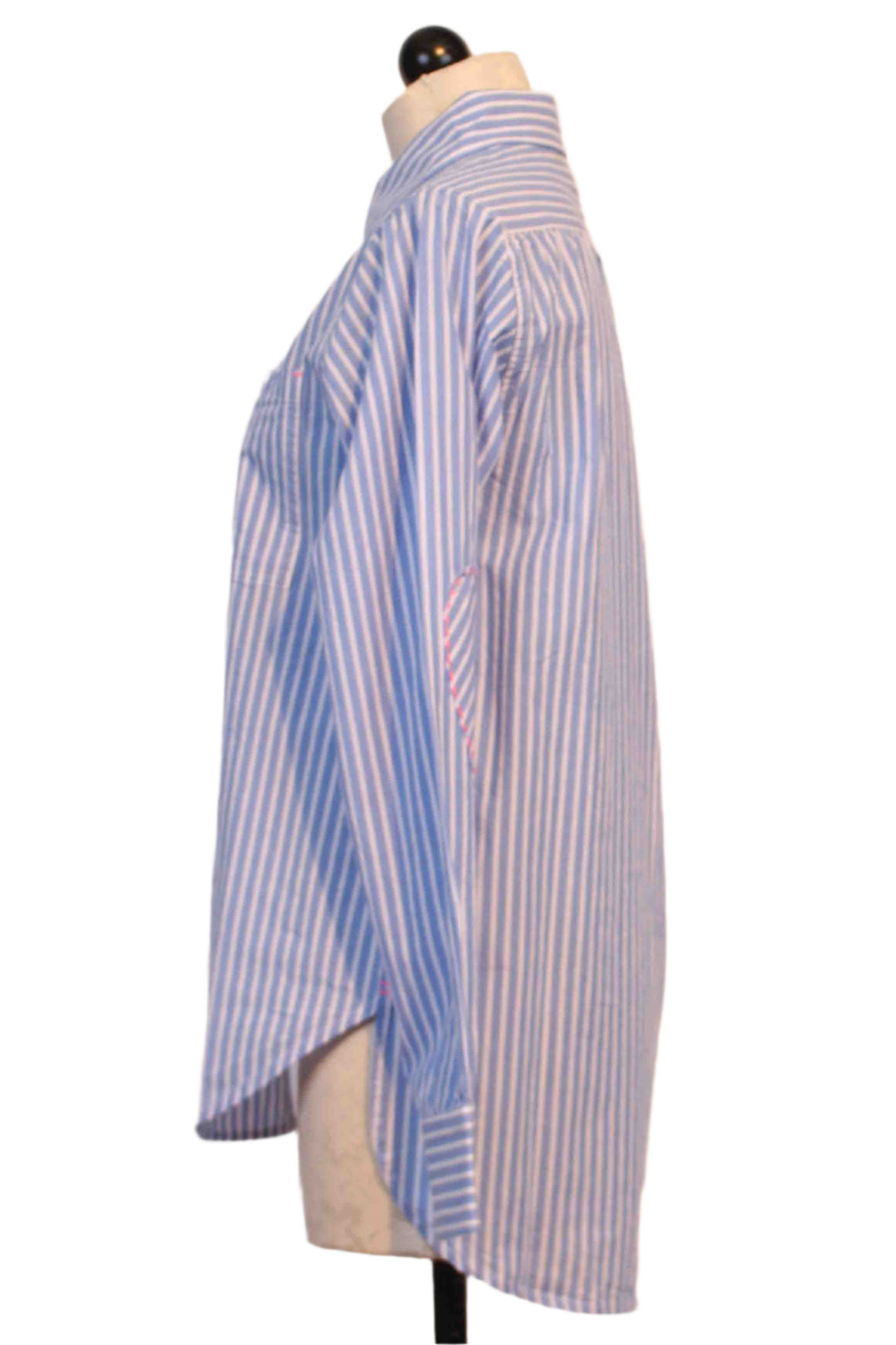 side view of Blue and White Stripe Mia Shirt by Kerri Rosenthal has a tiny bright pink embroidered heart below the front pocket and pink whipstitched hearts on the elbows of each sleeve