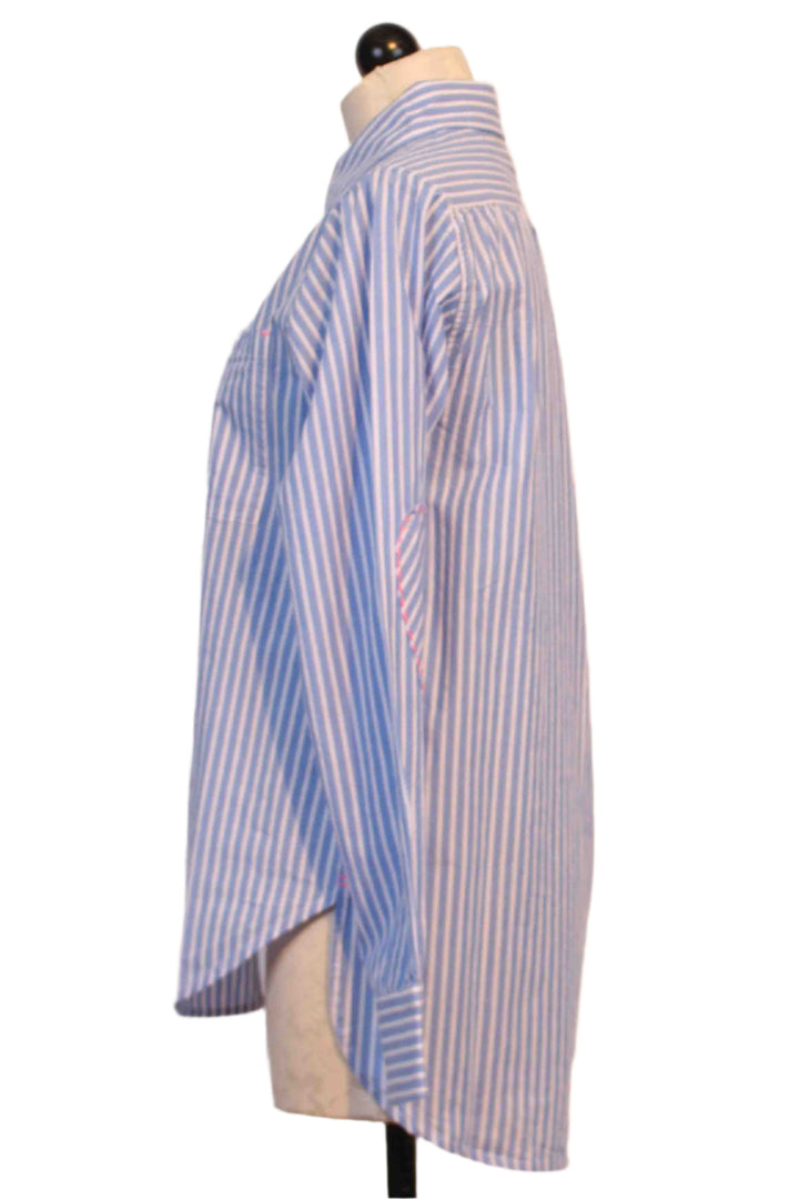 side view of Blue and White Stripe Mia Shirt by Kerri Rosenthal has a tiny bright pink embroidered heart below the front pocket and pink whipstitched hearts on the elbows of each sleeve