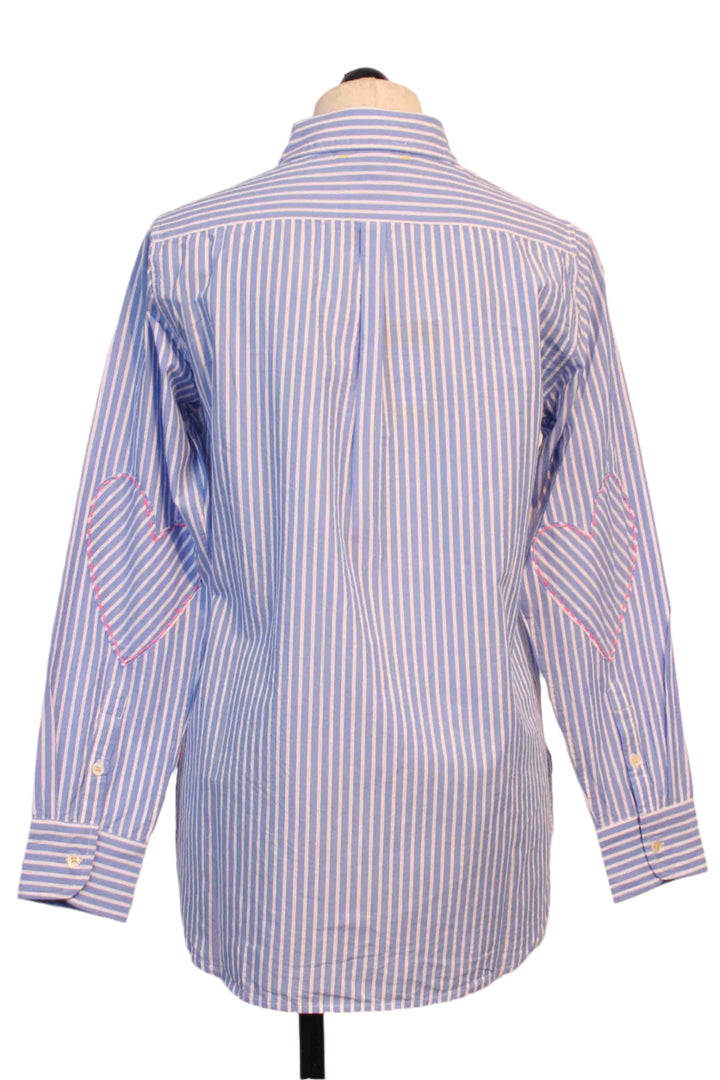 back view of Blue and White Stripe Mia Shirt by Kerri Rosenthal has a tiny bright pink embroidered heart below the front pocket and pink whipstitched hearts on the elbows of each sleeve