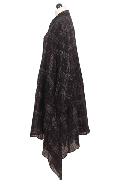 side view of black Sheer Plaid Long Shirt Dress by Moyuru with an asymmetrical hemline