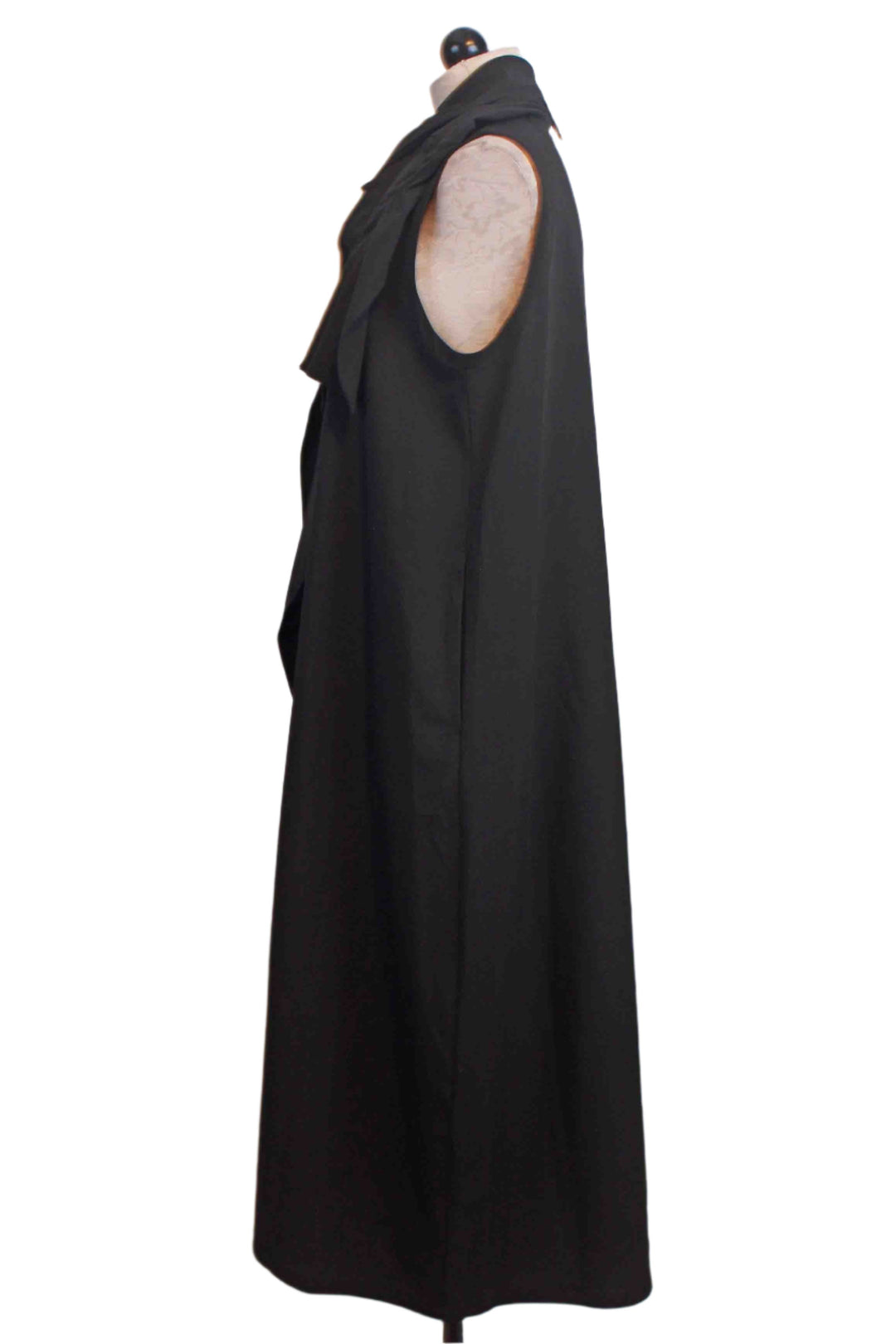 side view of black Sleeveless Dress with a Twisted and Pleated Neck that drapes down the front by Moyuru 