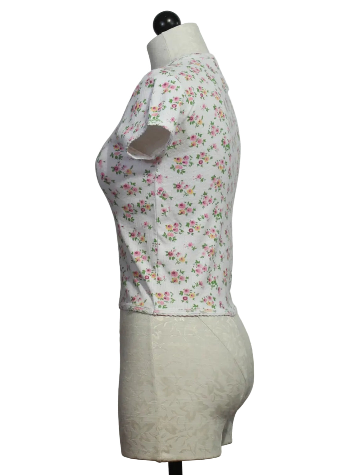 side view of The Floral Pointelle Cap Sleeve Baby Tee by Goldie Lewinter