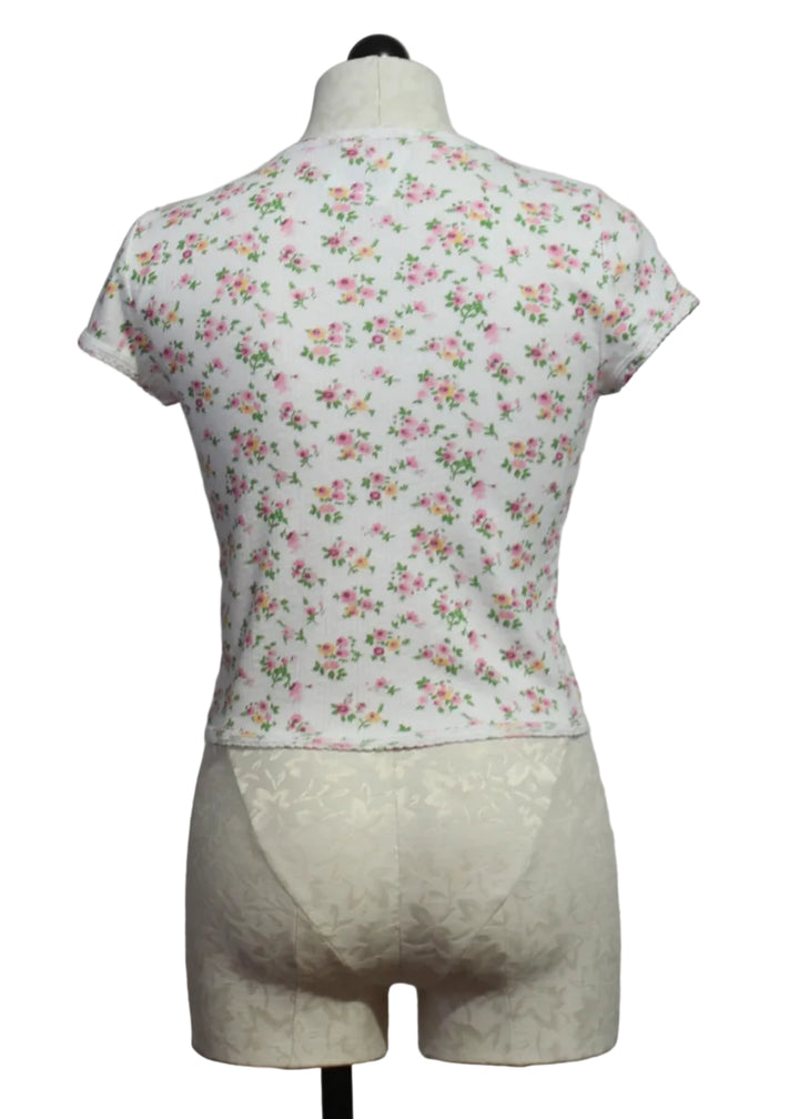 back view of The Floral Pointelle Cap Sleeve Baby Tee by Goldie Lewinter
