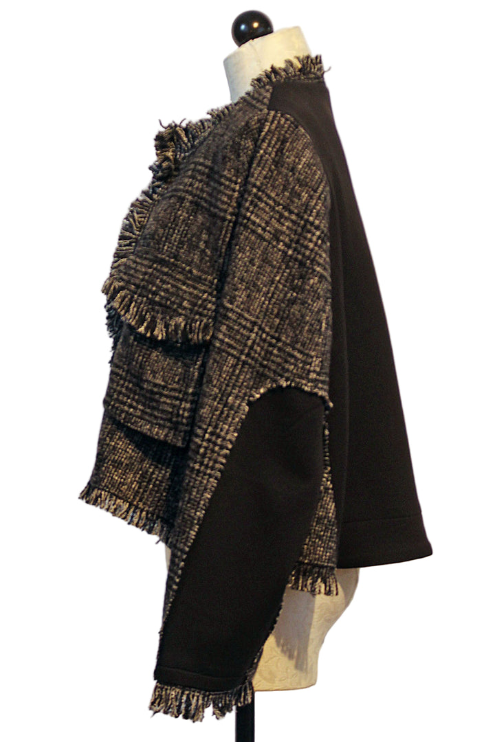 side view of Black and White Tweed Jacket by Moyuru with fringed edging and solid Black Back