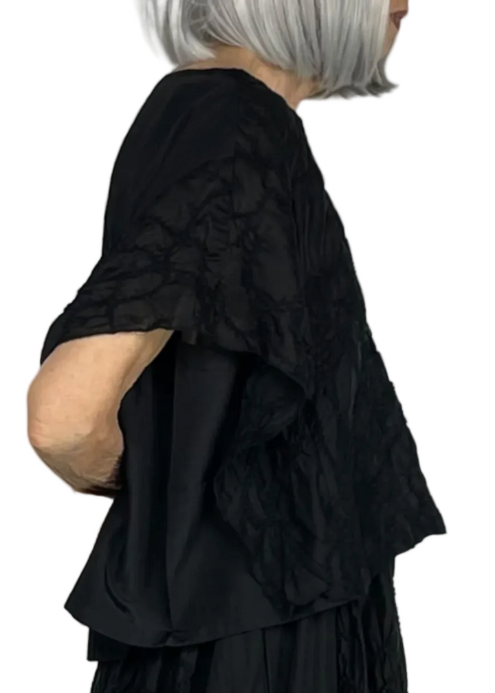 side view of Embroidered Cap Sleeve Cropped Top by Moyuru 