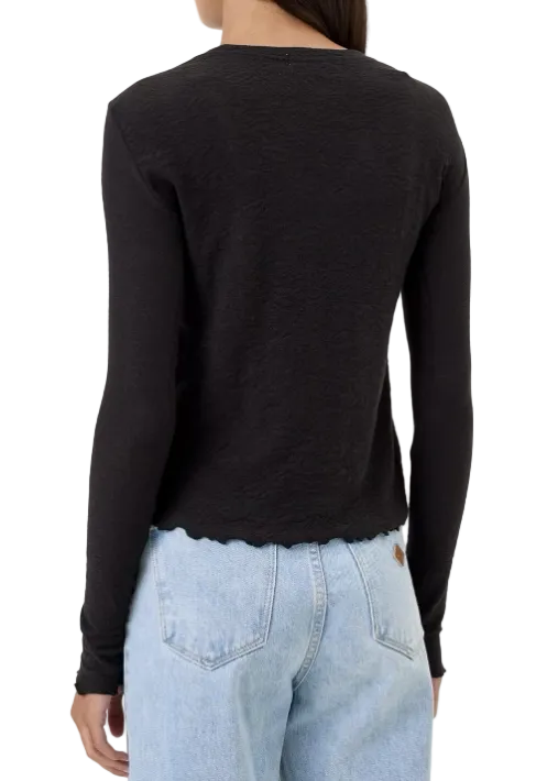 back view of The Cotton Jacquard Long Sleeve Tee by Goldie Tees in Black with a lettuce edge trim