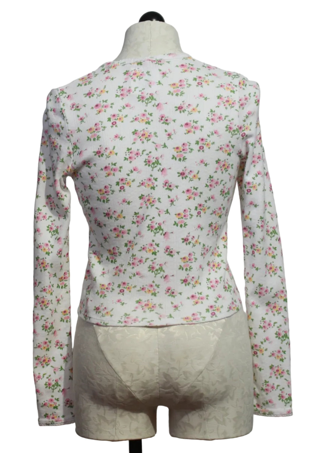 back view of The Floral Pointelle Long Sleeve Crop Cardi by Goldie Lewinter