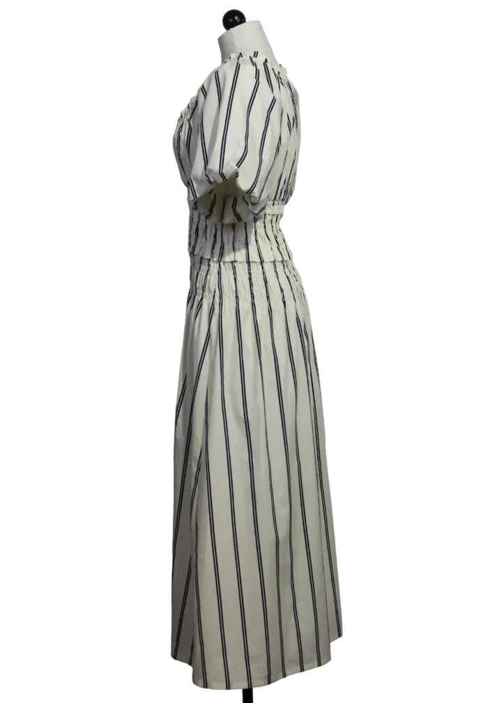 side view of Grayson Dress by Marie Oliver in a classic black and white vertical stripe 