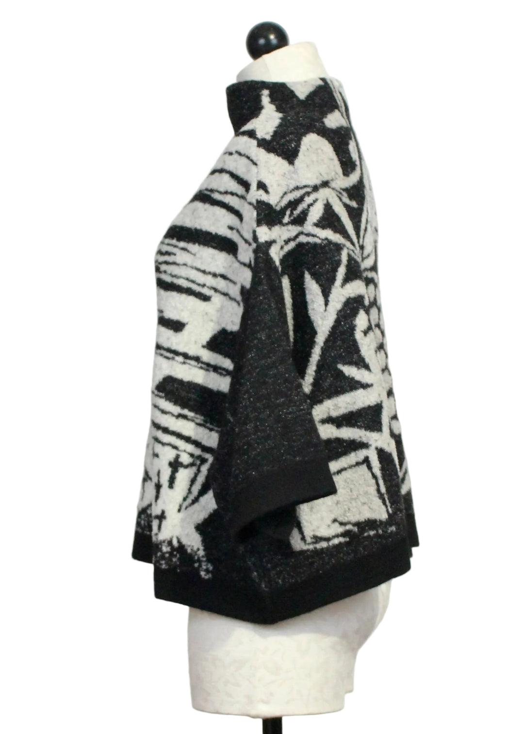 Side view of The Cropped Pullover Sweater by Moyuru in Black and Ivory