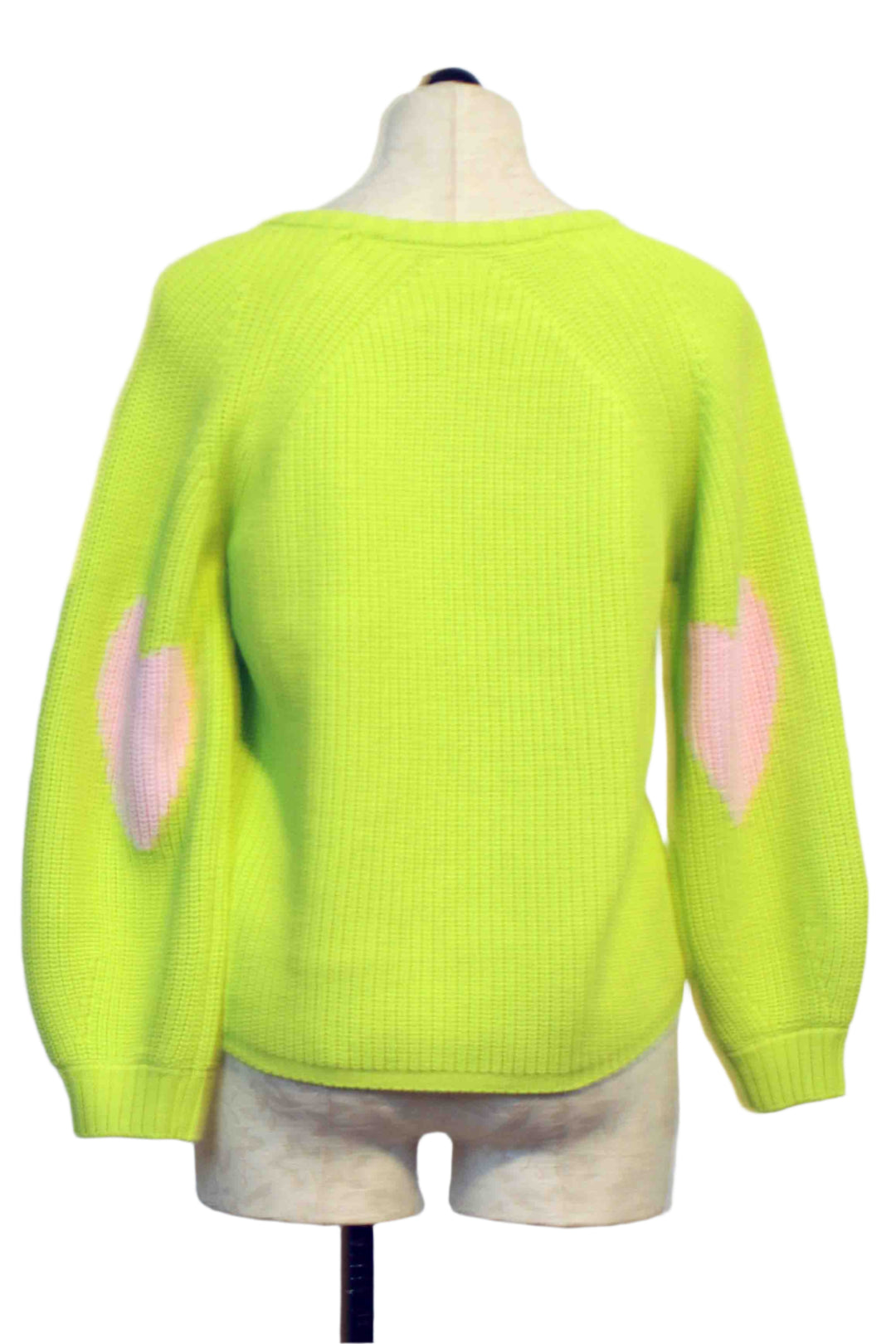 back view of Lime Green Ricki Imperfect Heart Sweater by Kerri Rosenthal with big Pink Hearts on each Elbow
