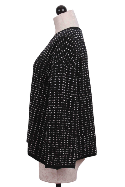 side view of black Textured Dot Swing Pullover Top by Liv by Habitat