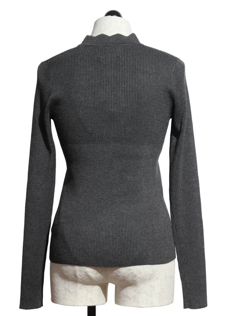 Back view of The Charcoal Bliss Scallop Edge Cardigan by Fifteen Twenty