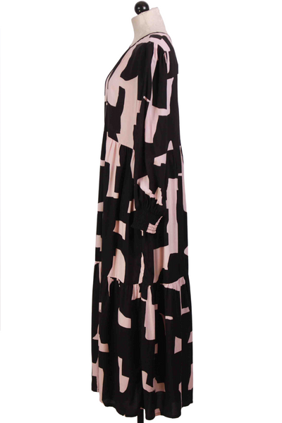 side view of Pink and Black Long Sleeve Tiered Midi Length Dress in an Abstract Print by Compania Fantastica