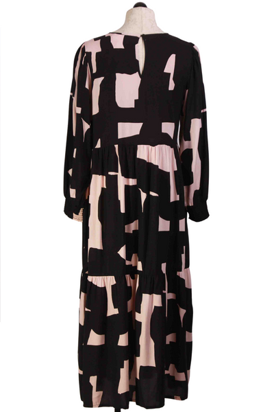 back view of Pink and Black Long Sleeve Tiered Midi Length Dress in an Abstract Print by Compania Fantastica