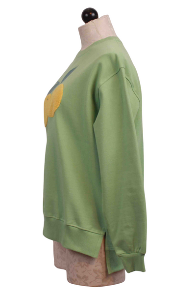 side view of Green Oversized Lemon Applique Sweatshirt by Compania Fantastica