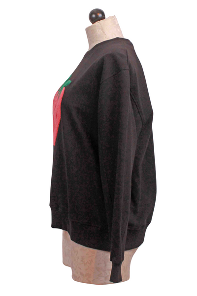 side view of Black Oversized Strawberry Applique Sweatshirt by Compania Fantastica