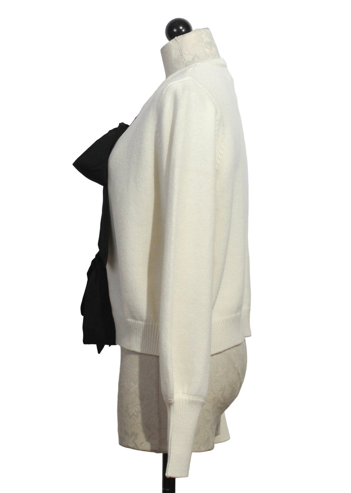 side view of Cream colored Black Ribbon tied Cardigan by Fifteen Twenty