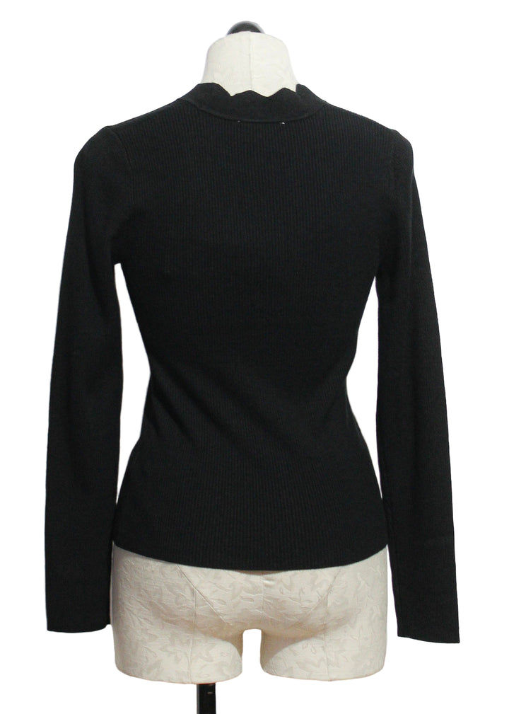 back view of black Bliss Ribbed Scallop Edge Cardigan by Fifteen Twenty