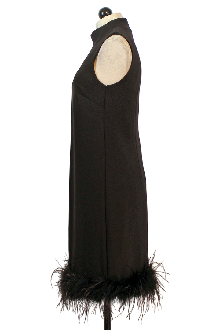 side view of Black Sleeveless Feathered Hem Dress by Compli K
