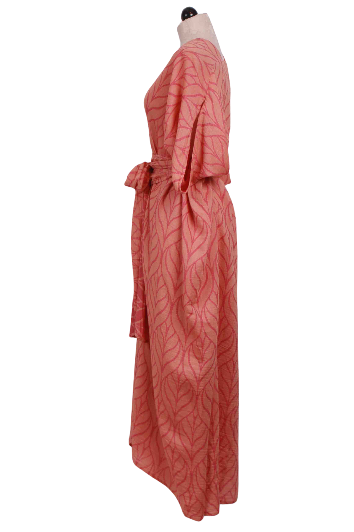 side view of Coral V Neck Tie Waist Erikousa Dress by Pearl and Caviar