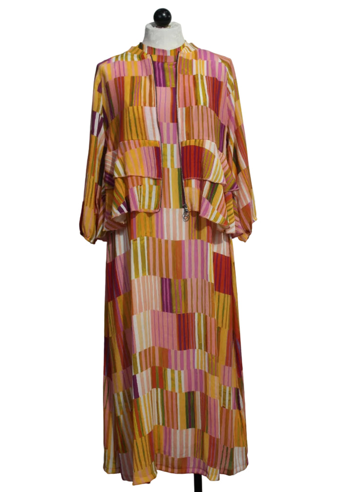 The Sleeveless Striped Tie Back Midi Dress by Aldo Martins paired with the matching Zip Front Striped Jacket with Tiered Ruffle Bottom by Aldo Martins