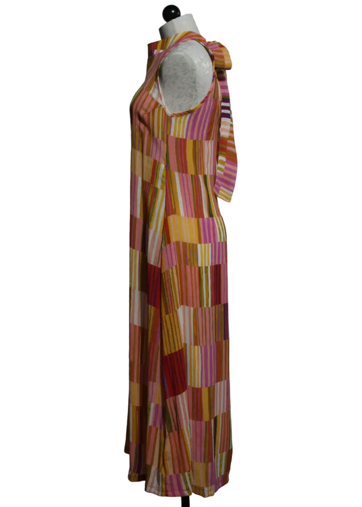 side view of The Sleeveless Striped Tie Back Midi Dress by Aldo Martins