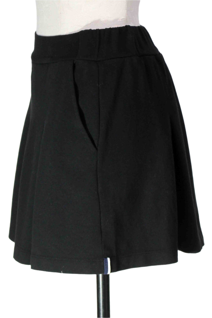 side view of Black Ponte Pleated Mini Skirt by Stateside 