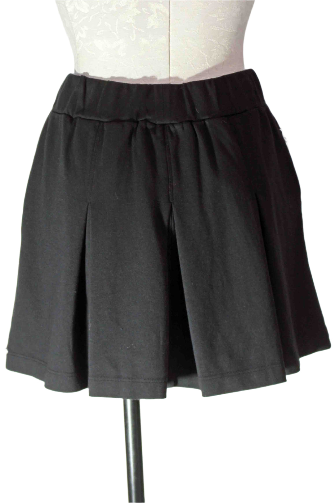 back view of Black Ponte Pleated Mini Skirt by Stateside 