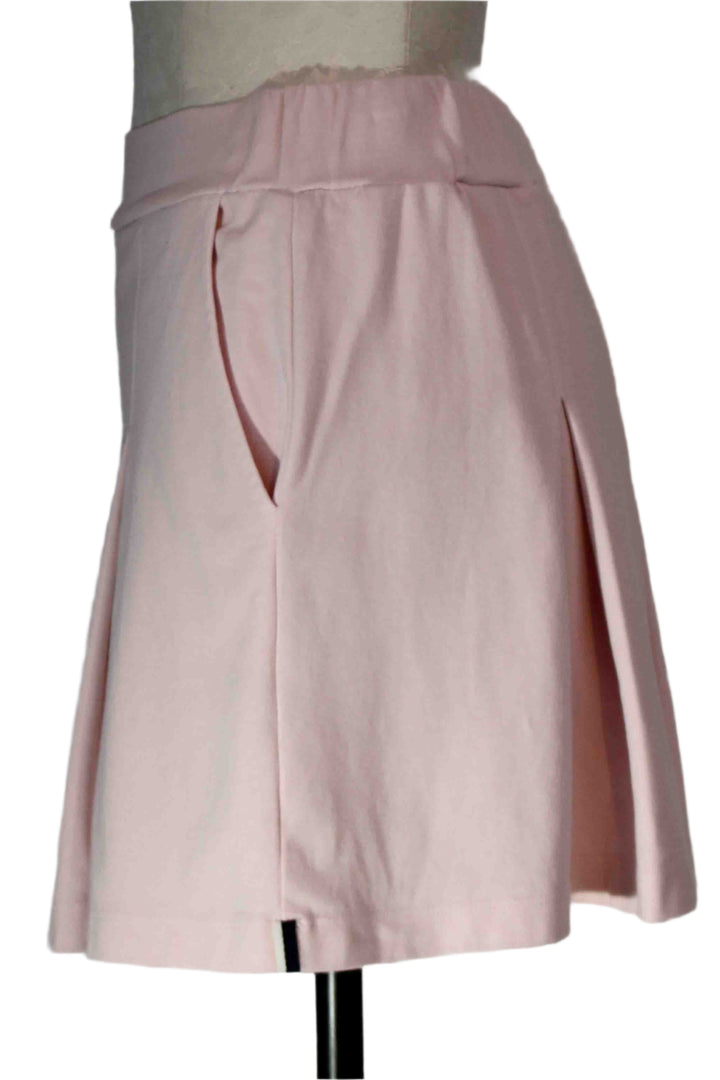 side view of Pink Tint Ponte Pleated Mini Skirt by Stateside 