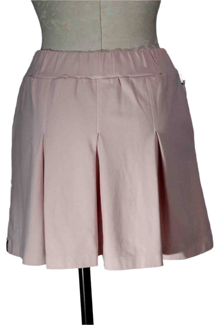 back view of Pink Tint Ponte Pleated Mini Skirt by Stateside 