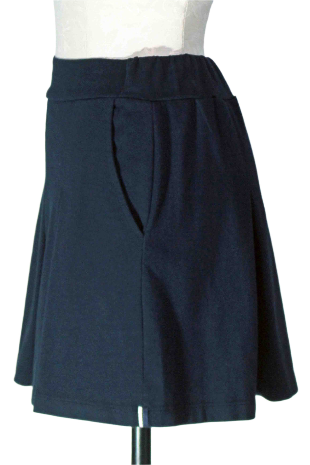 side view of New Navy Ponte Pleated Mini Skirt by Stateside 