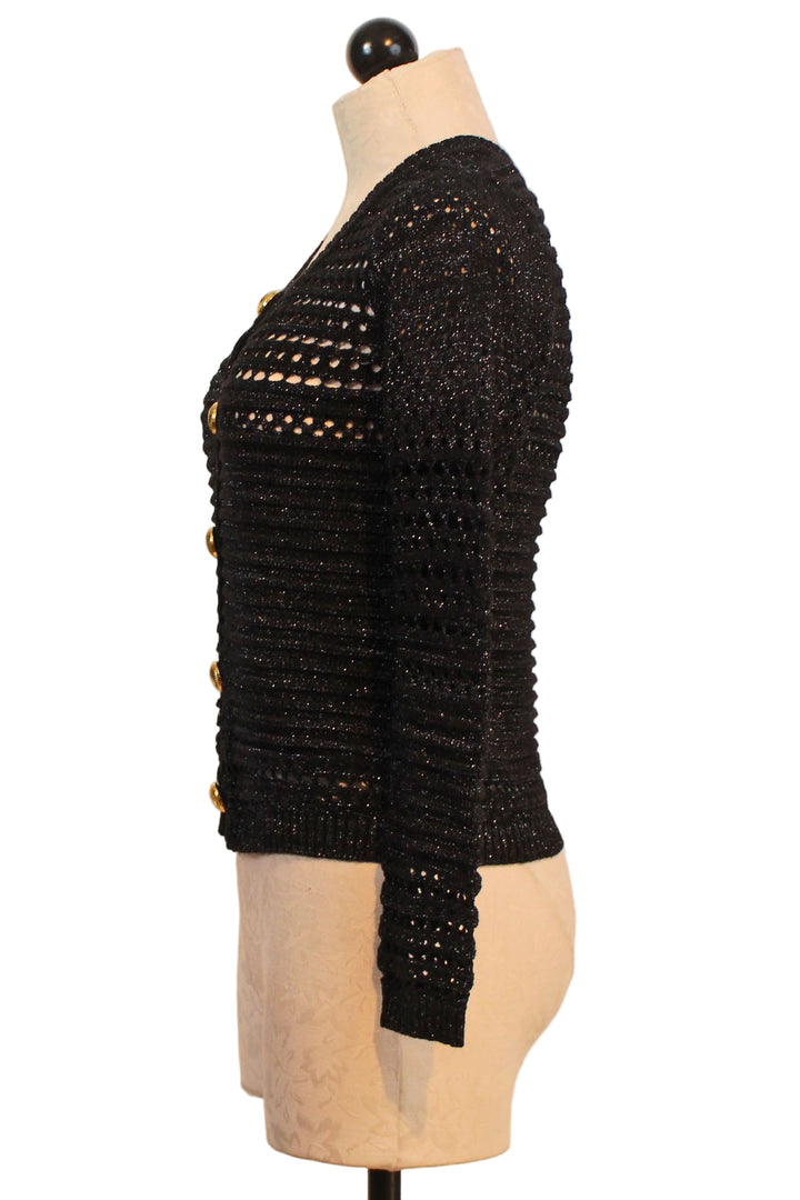 Side view of Gold Button Lurex Knit Crop Cardigan by Zero Degrees Celsius