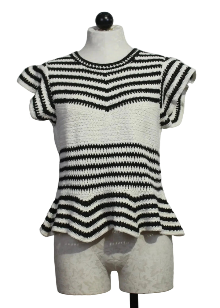 The knit Regatta Knit Black and White Striped Audrey Top by Marie Oliver with ruffled shoulders and a peplum bottom