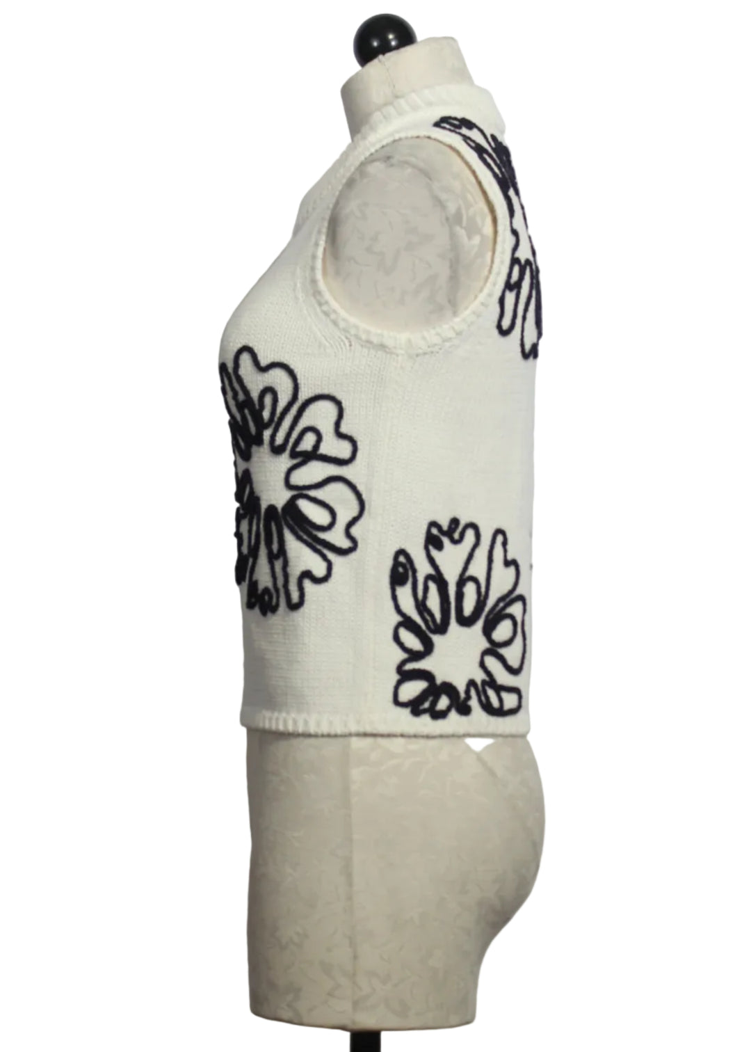side view of Cream colored Sleeveless Natasha Top by Marie Oliver with Navy Embroidered Flowers