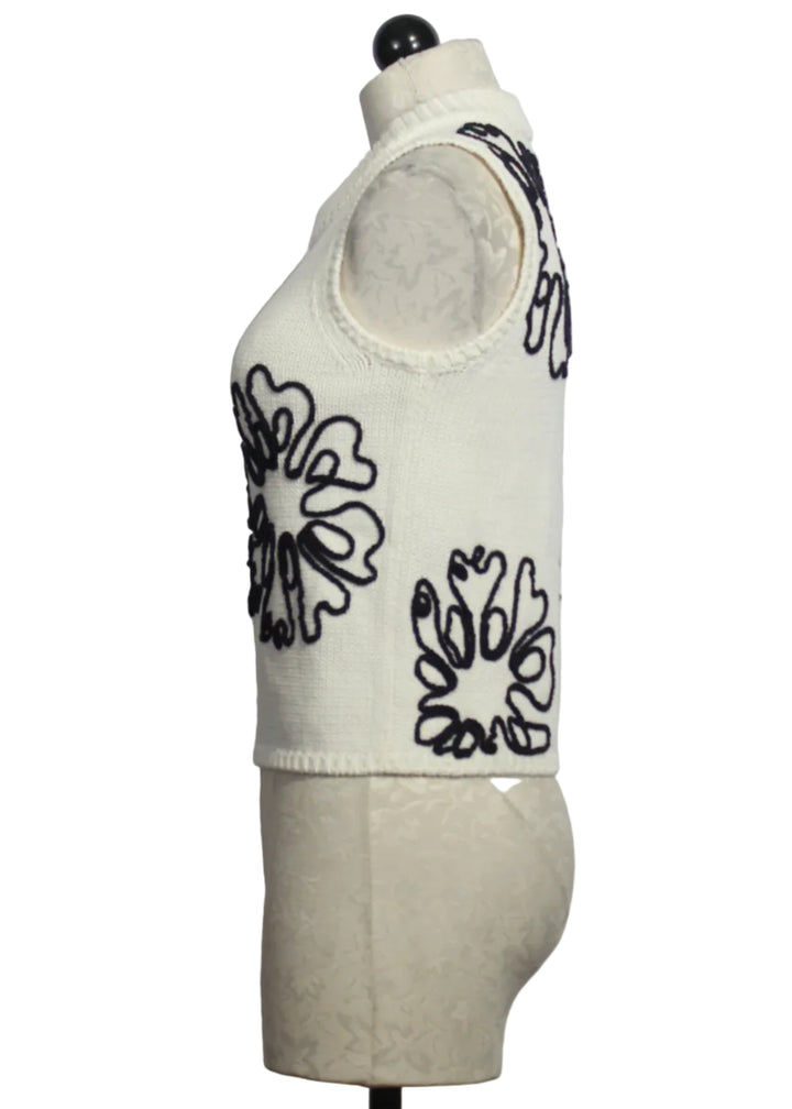 side view of Cream colored Sleeveless Natasha Top by Marie Oliver with Navy Embroidered Flowers