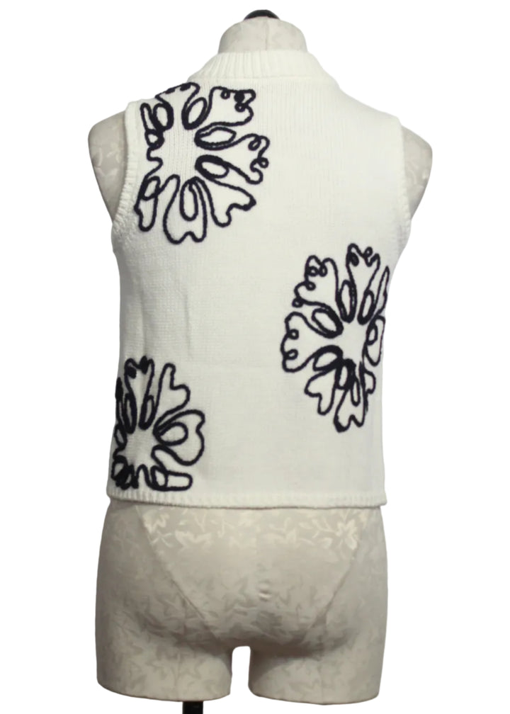 back view of Cream colored Sleeveless Natasha Top by Marie Oliver with Navy Embroidered Flowers
