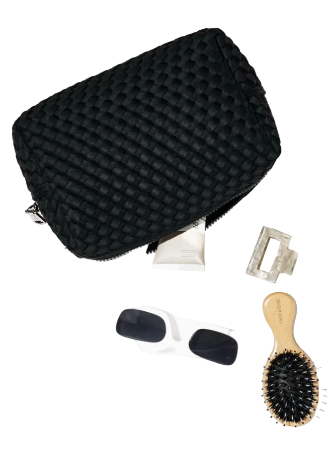 Attitude Woven Neoprene Cosmetic Pouch by Sol and Solene laying down with items coming out of it
